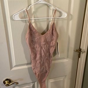 Aura Pink/mauve bodysuit. Size M/L. Tried on, but never got the chance to wear.